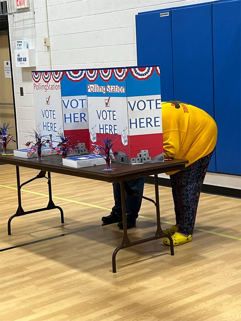 people voting at polling station
